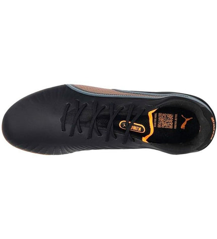 Black Puma King Ultimate MG adult soccer cleats for outdoor football, lightweight and designed for optimal grip on the field.