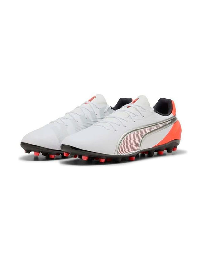 Puma King Match Mg adult soccer cleats in black and white, designed for outdoor football with durable studded outsole.