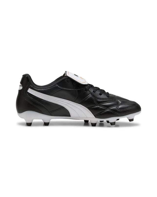 Puma King Top FG/AG adult football shoes with black and white design, suitable for outdoor and indoor soccer play