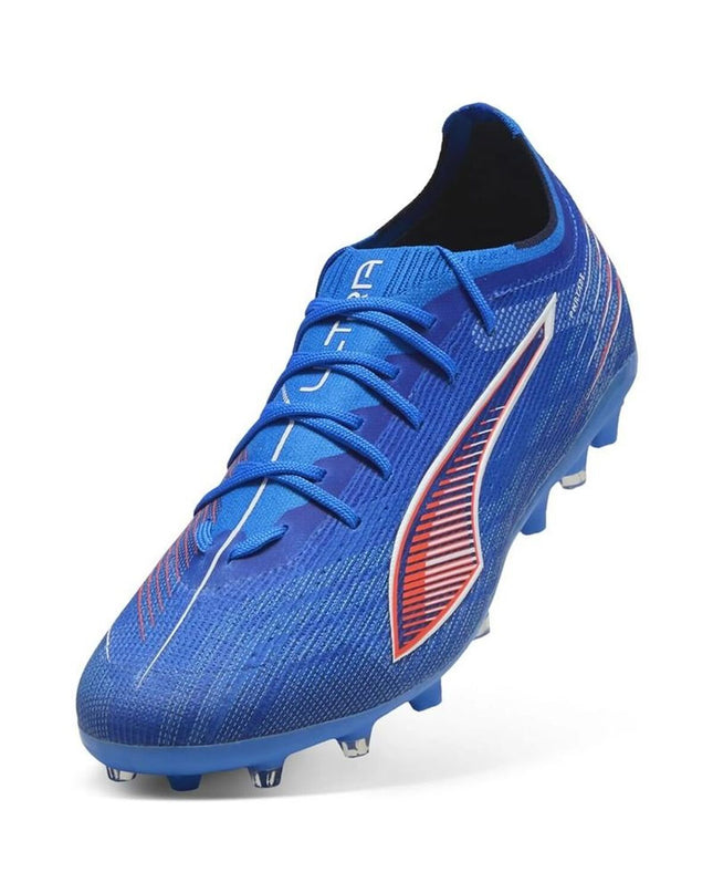 Puma Ultra 6 Pro Mg outdoor football shoes for adults, white with black accents, lightweight sport footwear for soccer.