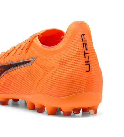 Puma Ultra 6 Pro MG heat fire black soccer cleats for adults, designed for outdoor football, with black and fire orange accents.