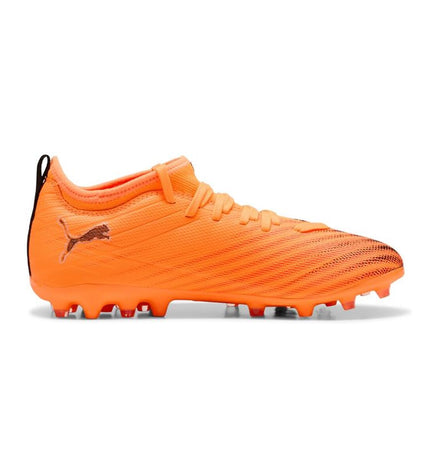 Puma Ultra 6 Match Mg Heat Fire football cleats for sport and outdoor soccer, black with orange accents, in action.