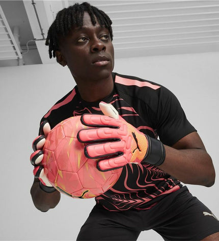 Puma Future Match NC football goalkeeper gloves in dark orange with black accents, designed for sport and outdoor use.