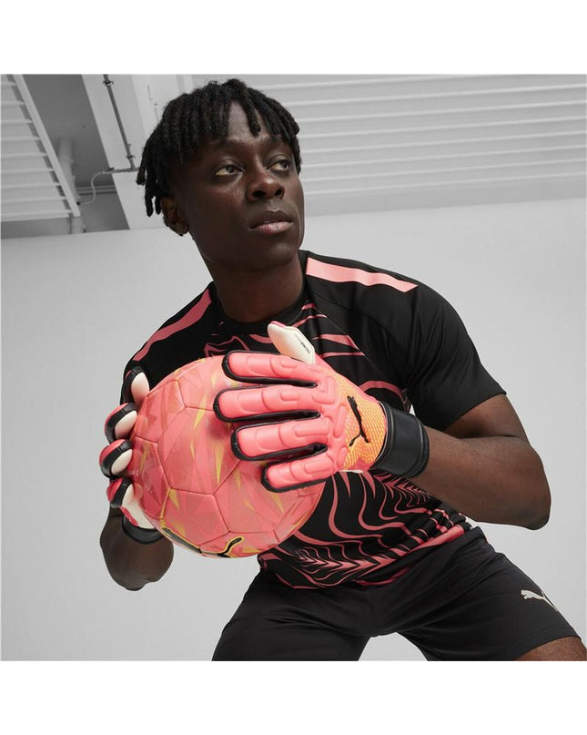 Puma Future Match NC football goalkeeper gloves in dark orange with black accents, designed for sport and outdoor use.
