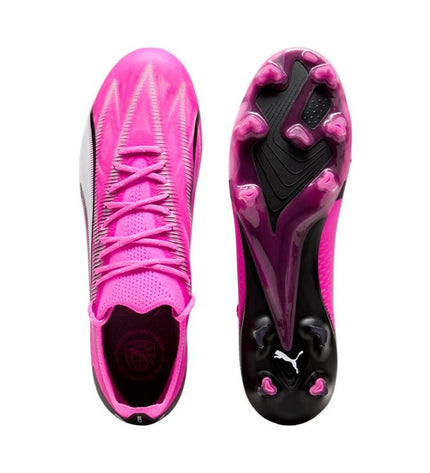 Pink Puma Ultra Ultimate FG/AG adult football cleats for sport and outdoor play, with sleek design and studded sole for optimal grip.