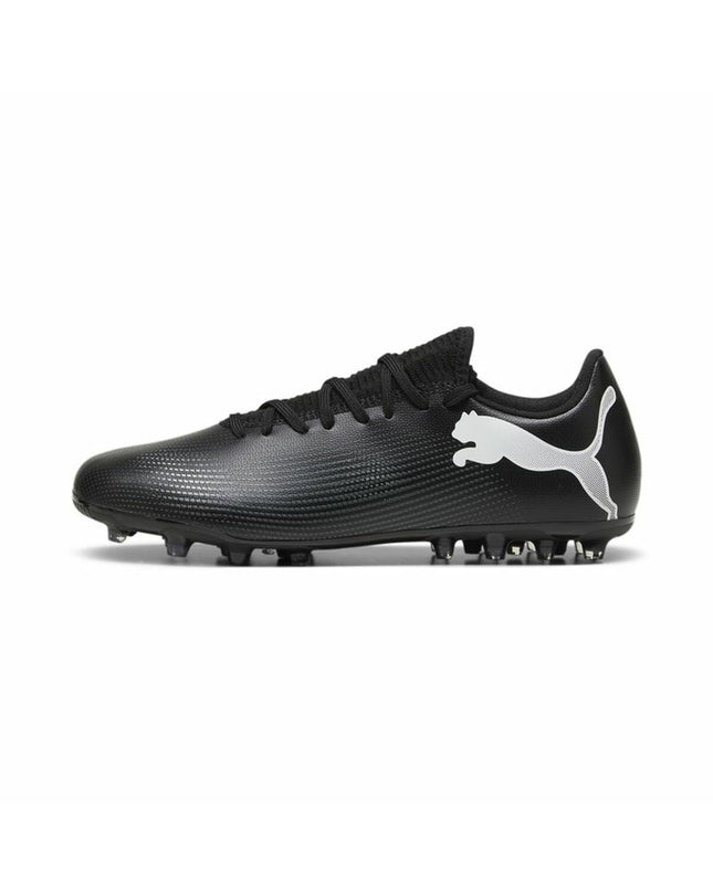 Puma Future 7 Match MG adult football boots in white and black, designed for outdoor soccer, with a sleek sport style.
