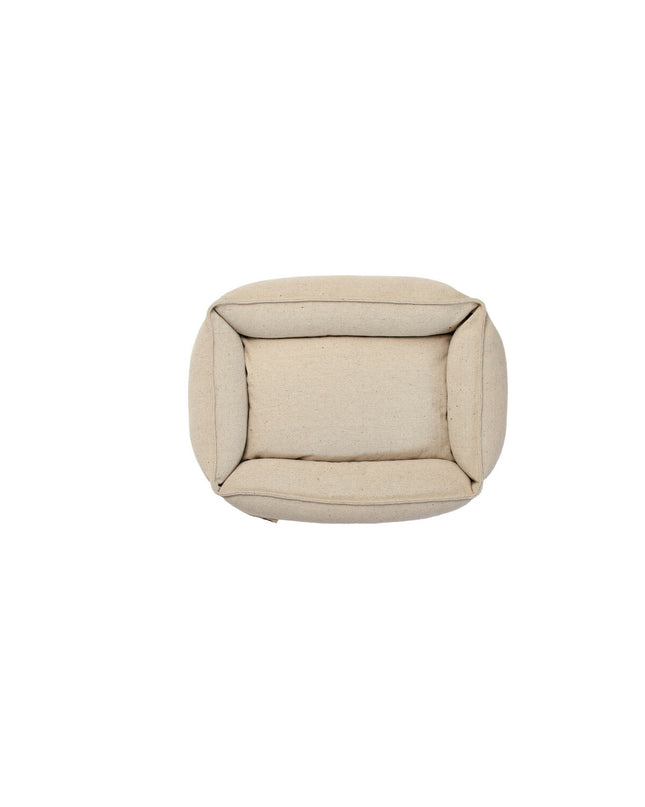 Hunter Belluno beige dog bed in 80x60 cm with plush fabric and cushioned sides, ideal for small to medium-sized dogs.