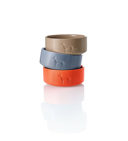 Orange ceramic dog feeder bowl by Hunter OSBY, 550 ml capacity, designed for feeding dogs, with a sleek, modern appearance.