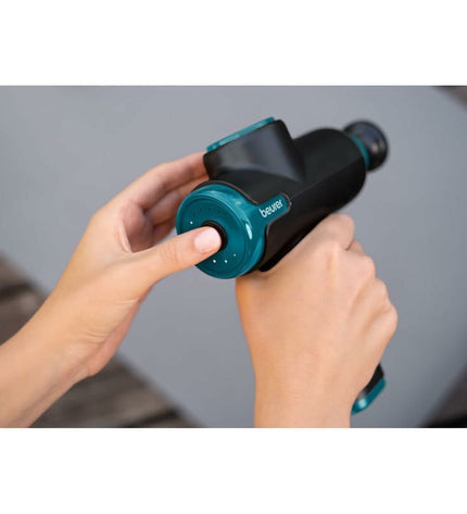 Beurer MG99LE massager for health and personal care, showing a close-up of the handheld device with control buttons.
