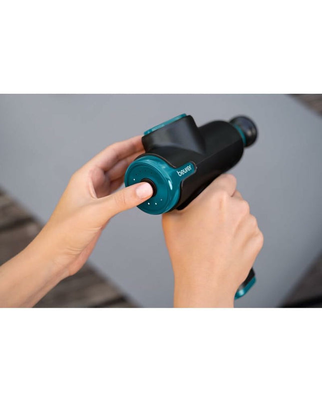 Beurer MG99LE massager for health and personal care, showing a close-up of the handheld device with control buttons.