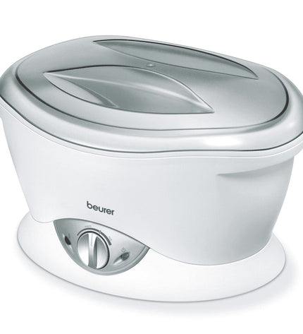 Beurer electric hand massager for health and wellness, shown in use with adjustable settings and ergonomic design.