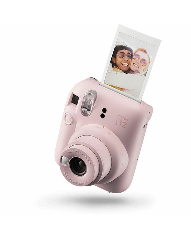 Fujifilm Mini 12 instant photo camera in pink, compact electronic device for photography and instant print photos.