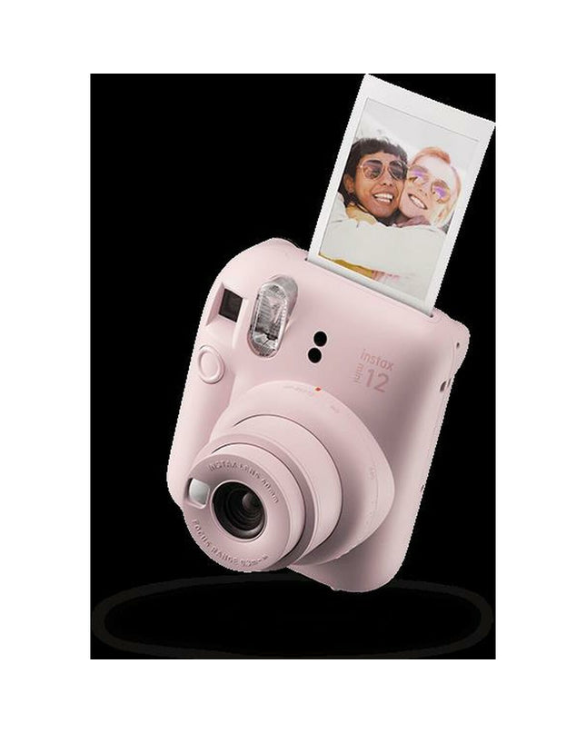 Fujifilm Mini 12 instant photo camera in pink, compact electronic device for photography and instant picture printing.