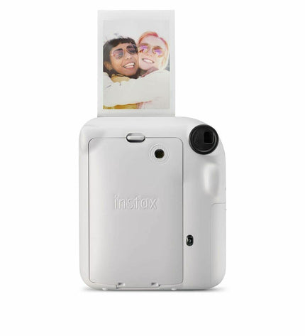 Fujifilm Mini 12 instant photo camera in white, electronic photography device with compact design, ready for instant photos.
