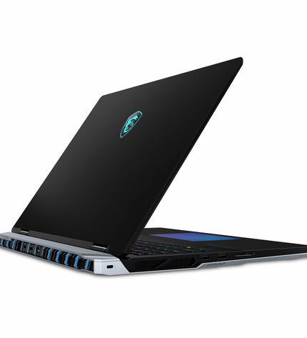 MSI laptop with sleek design, shown from the side, featuring a keyboard, screen, and ports in a modern workspace setting.