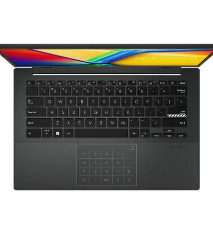 Asus VivoBook 14 S1404 laptop with 14-inch display, 16 GB RAM, and 512 GB SSD, showing a sleek silver design and QWERTY keyboard