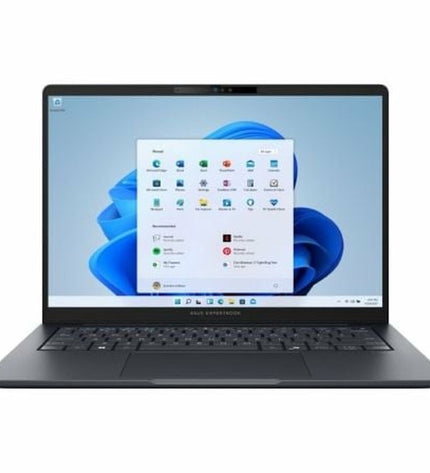 Asus ExpertBook B5 laptop with 14-inch display, Intel Core Ultra 7, 32GB RAM, and 1TB SSD on a clean workspace.
