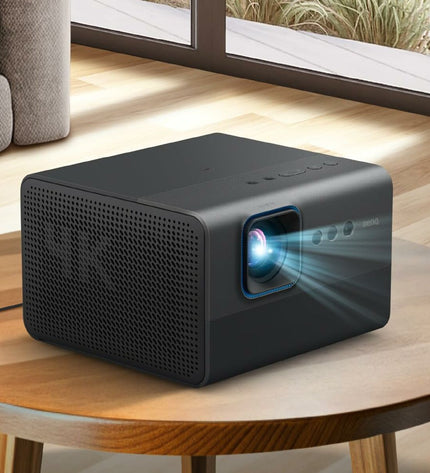 BenQ full HD projector for home theater, displaying a bright image on a wall in a living room setting.