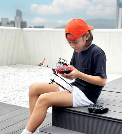 Red Flybotic remote-controlled police car toy for children, featuring realistic vehicle details and vibrant color.