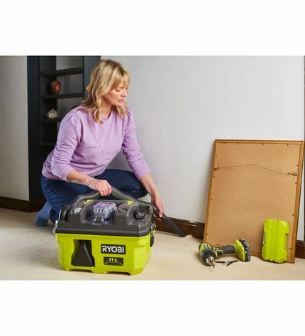 Ryobi 18V cordless vacuum cleaner for home cleaning, showing the compact design and brand logo in a modern setting.