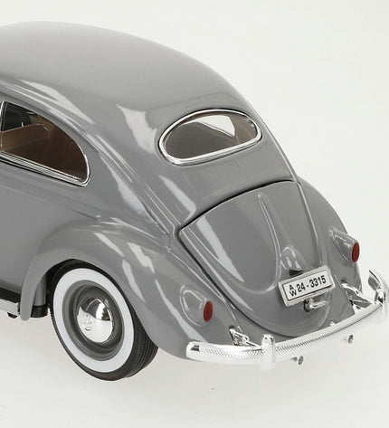 Bburago 1:18 scale Volkswagen Kafer Beetle toy car from 1955, detailed miniature model in vibrant colors.