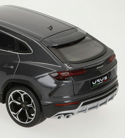 Bburago Lamborghini Urus 1:18 scale toy car, detailed miniature vehicle in metallic yellow with black accents.