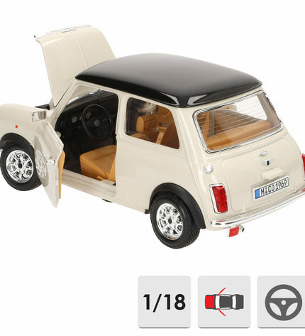 Bburago 1:18 scale GT-Mini Cooper (1969) toy car, detailed model in red with black racing stripes on a display surface.