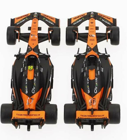 Set van 2 zwarte McLaren F1 speelgoedauto's in 1:43 schaal, detailed miniature vehicle models for children and collectors.