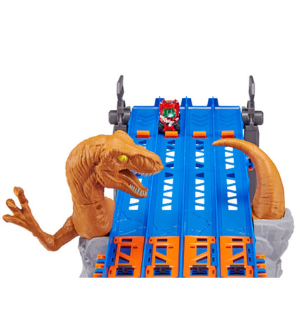 Zuru Metal Machines Raptor Attack 4-lane race track with cars and detailed dinosaur-themed track layout.