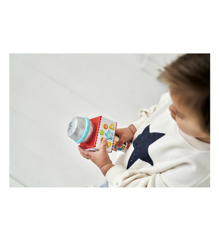 Fisher-Price karaoke microphone toy featuring colorful animal designs, ideal for children's musical play and singing activities.