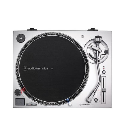 Audio-Technica Iberia AT-LP120XUSBSV silver turntable with tonearm and control knobs, showcasing its sleek design and build.