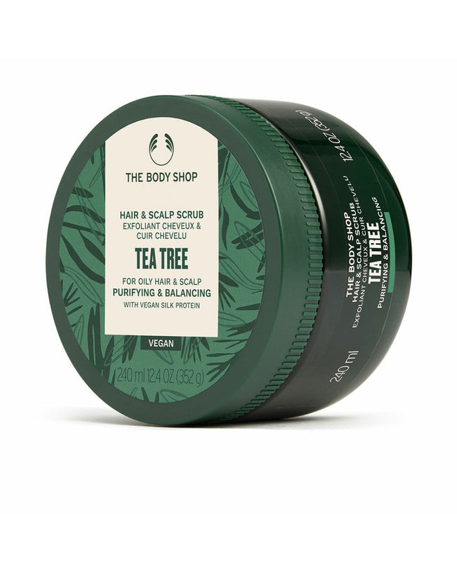 The Body Shop Tea Tree nutrition supplement bottle, 240 ml, with green label and white cap, used for health and personal care.