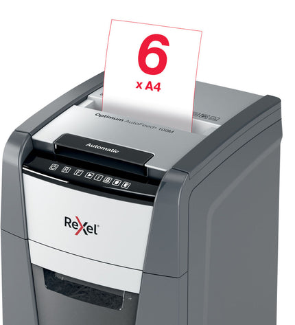 Rexel Optimum Auto+ paper shredder for office use, compact with auto-features, shown on a desk with shredded paper.