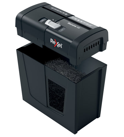 Rexel Secure X6 10L paper shredder for office use, with a black plastic body and paper entry slot in a modern office setting