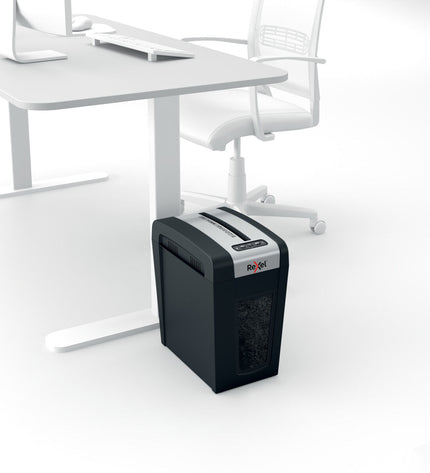 Rexel MC6-SL paper shredder for office use, compact design with metal blades, suitable for confidential document disposal.