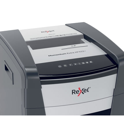 Rexel Momentum Extra XP422+ paper shredder for office use, with visible shredding slot and control panel in a professional workspace