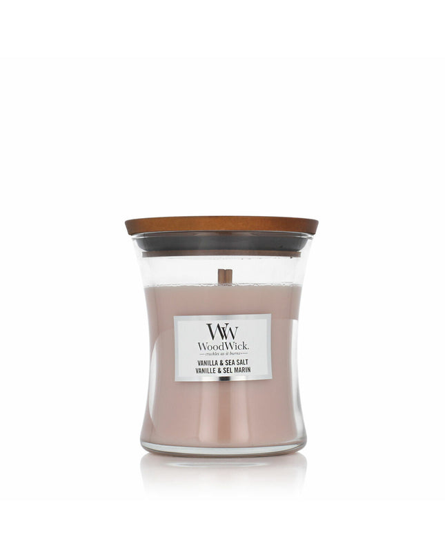 Woodwick Woodwick scented candle with wooden wick, cream-colored glass jar, and decorative lid for home decor and ambiance.