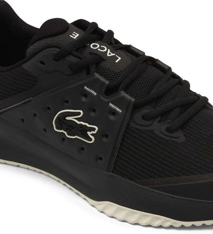 Black Lacoste Power Serve tennis shoes for women, sport outdoor footwear with a sleek design and Lacoste branding.