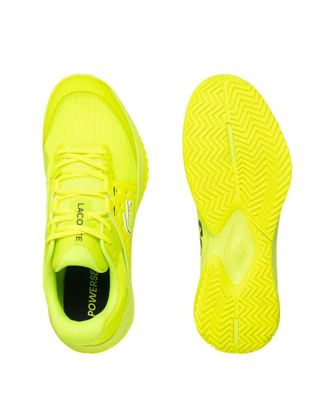 Yellow Lacoste Power Serve men's tennis shoes featuring breathable mesh and supportive soles for outdoor tennis play.