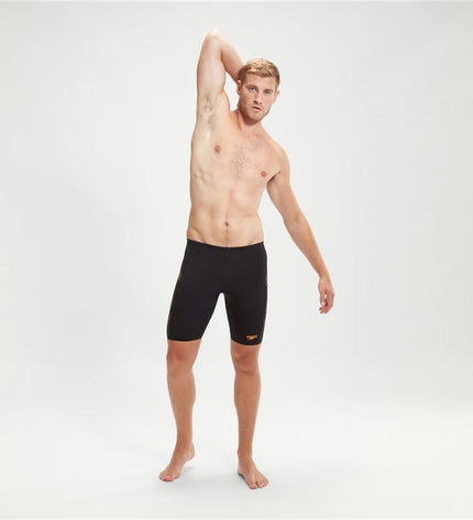 Black Speedo Tech Panel Jammer men's swim trunks, designed for competitive watersports and athletic swimming.