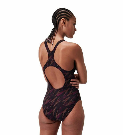 Speedo Hyperboom allover orange women's swimsuit for water sports, featuring a vibrant, patterned design.