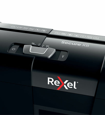 Rexel Secure X8 paper shredder for office use, showing the shredding slot and control panel in a modern office setting.