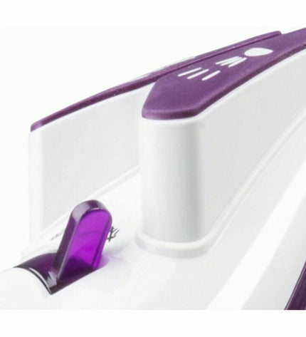 Haeger Pro Glider 2600W steam iron with ergonomic handle and water spray, suitable for household ironing tasks.