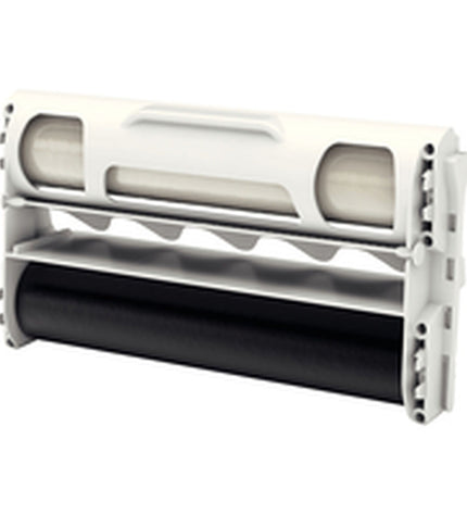 Xyron transparent laminator for office use, showing the device with visible control panel and transparent body in a workspace setting.