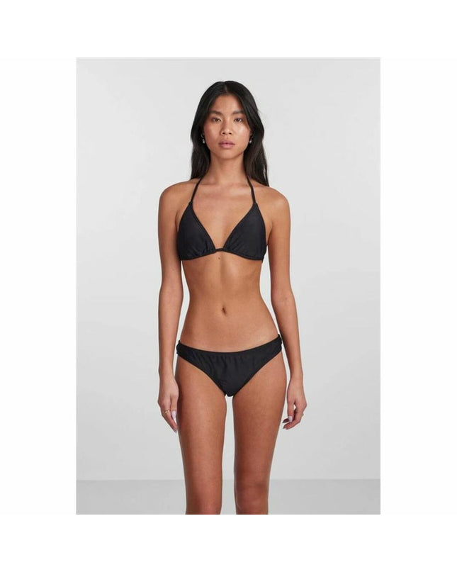 Black Pieces bikini slip pieces for sport and watersport, shown on a model with a focus on the swimwear's fit and fabric.