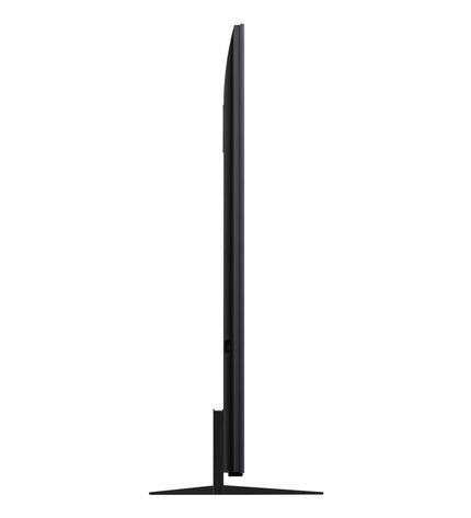 TCL 85-inch 4K Ultra HD HDR QD Mini LED Smart TV displaying vibrant colorful images in a modern living room setting