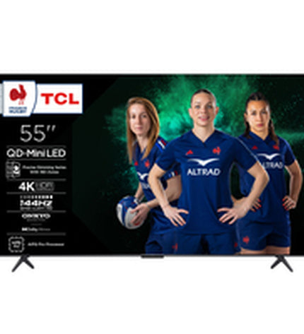 TCL 55C6K 4K Ultra HD Smart TV with HDR and QLED display, showing a vibrant, colorful screen in a modern living room setting.