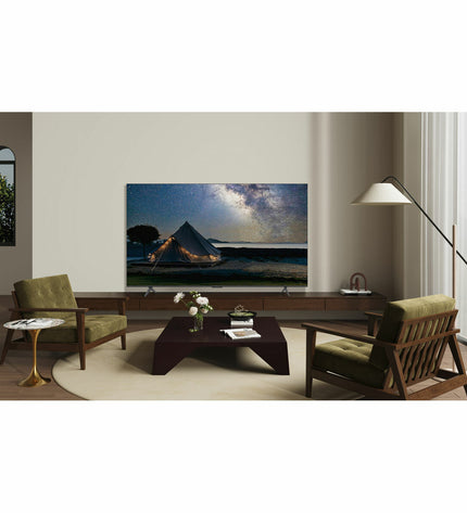 TCL 75-inch 4K Ultra HD HDR QLED Smart TV displaying vibrant images and slim black frame in a modern living room setting.