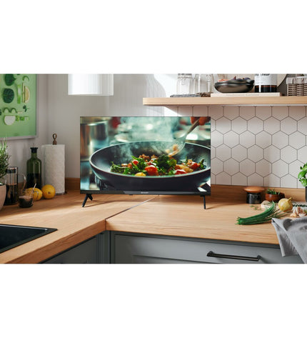 Sharp 24-inch LED Smart TV with slim bezel and screen displaying colorful images, suitable for home entertainment.