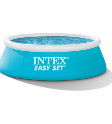 Intex Easy Set inflatable swimming pool with 183x51 cm size, filled with water, set up outdoors for summer fun.